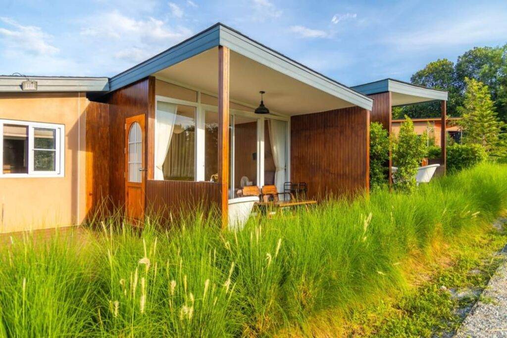 prefab granny flat in a lush backyard garden setting